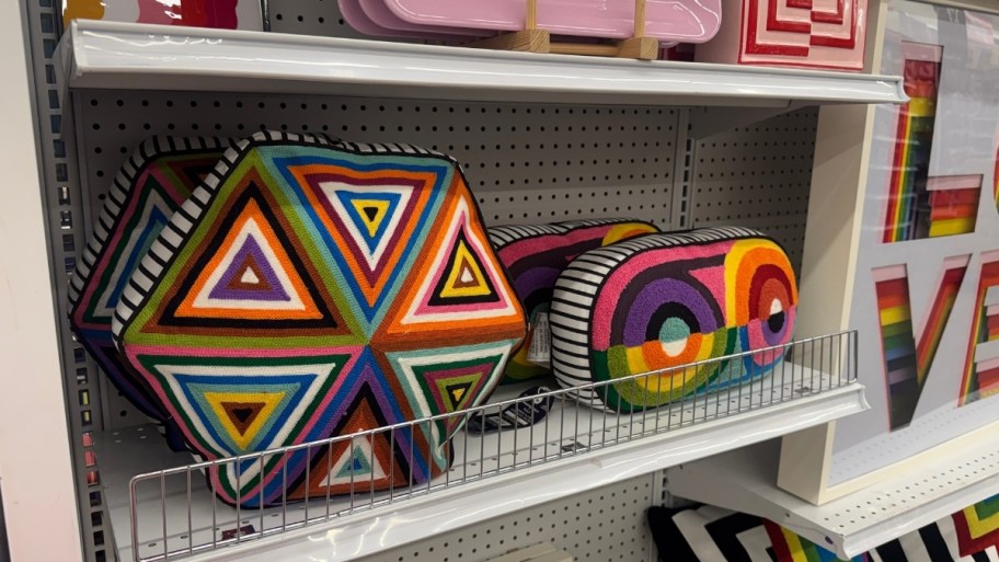 geometric design throw pillows on a store shelf