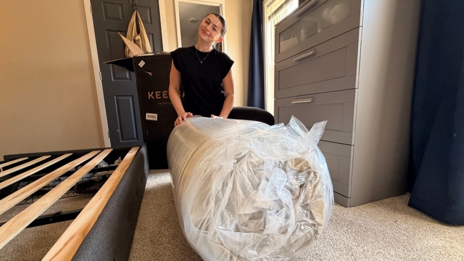 woman unboxing a keetsa mattress