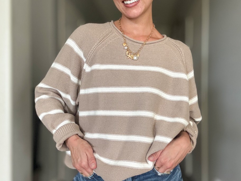 woman wearing tan and white striped sweater 