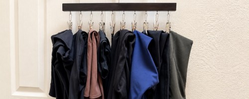 leggings organizer with 10 pair of leggings hanging on a door