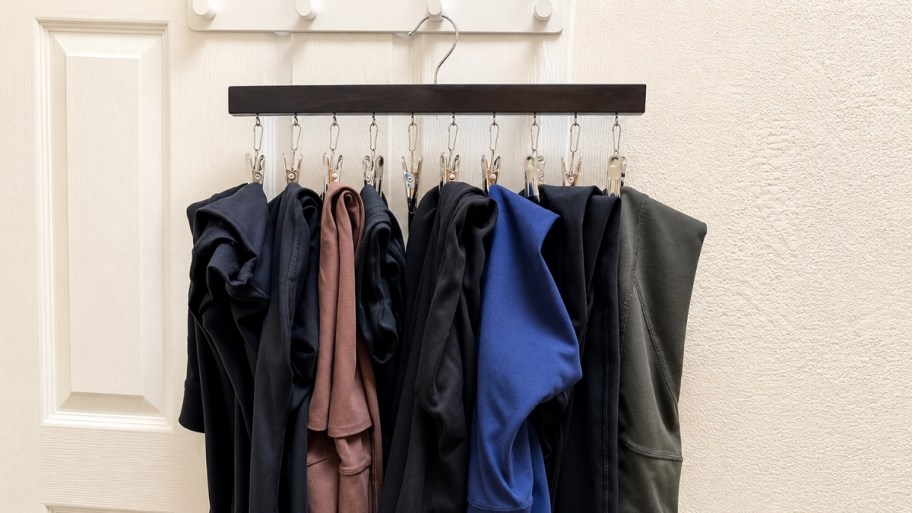 leggings organizer with 10 pair of leggings hanging on a door 