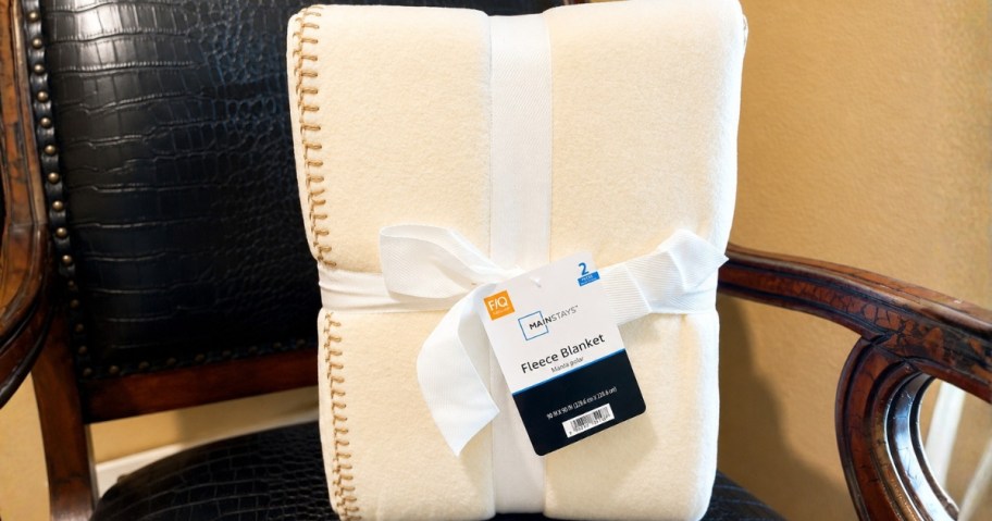 cream color fleece blankets on a chair
