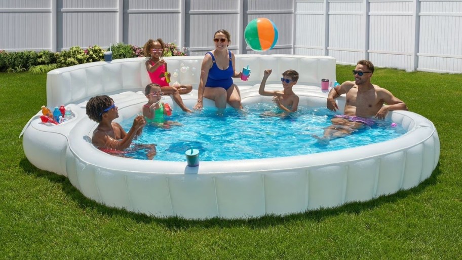 people lounging in a white inflatable family people