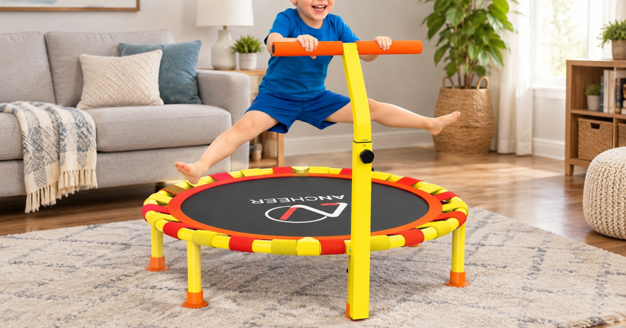 little boy bounding on a mini trampoline in a living room