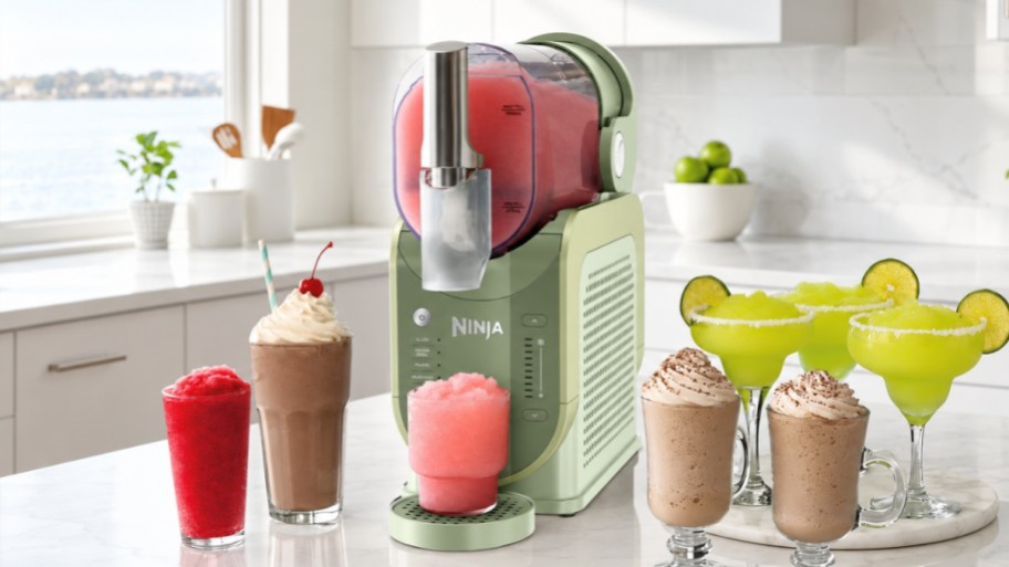 a green ninja slushi machine on a kitchen counter with drinks