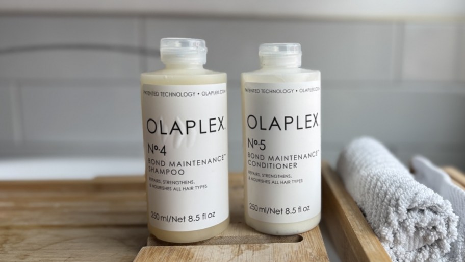 olaplex N4 shampoo and no 5 conditioner next to a bathtub