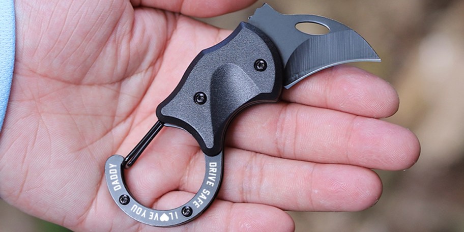 hand holding knife keychain