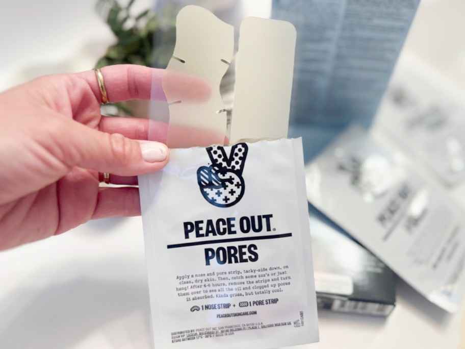 hand holding peace out pores strip pack