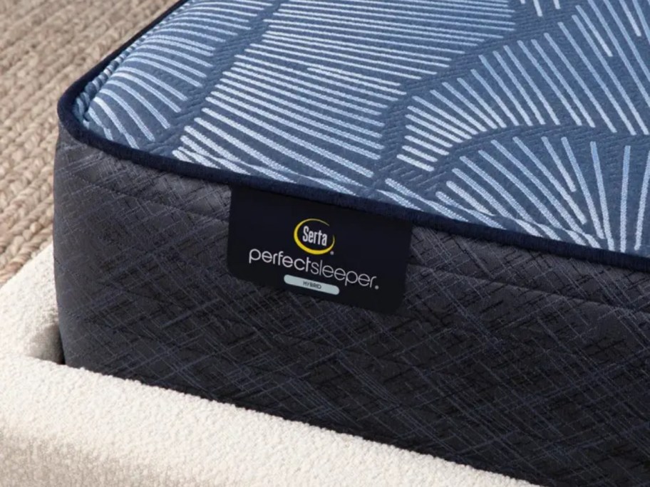 corner of blue Serta mattress