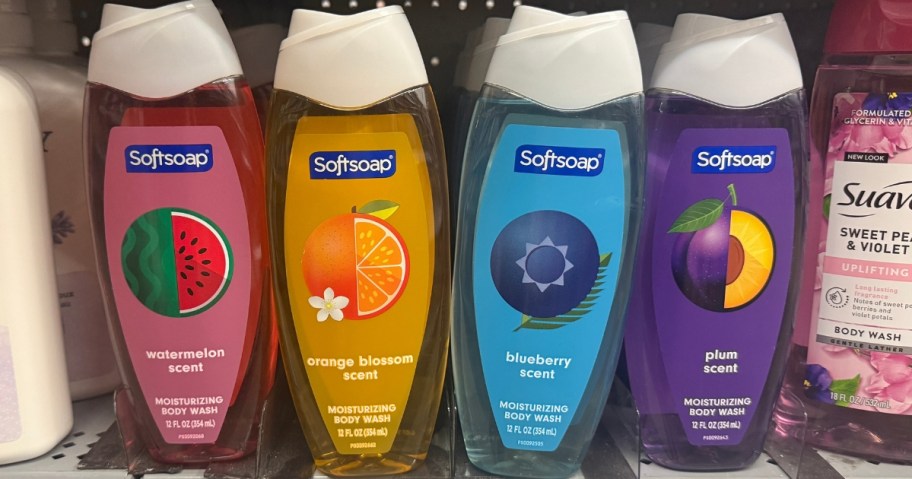 four Softsoap body washes on a store shelf