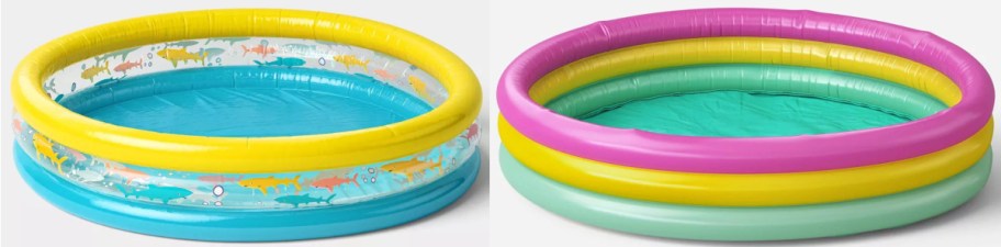 Two inflatable kiddie pools are side by side. The left has yellow, fish-themed sides with a blue base. The right is striped with pink, yellow, and green rings.