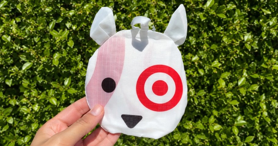 hand holding a Target Bullseye Dog reusable bag folded up 