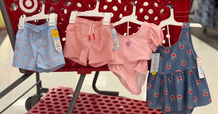 kids swimwear hanging on cart in store
