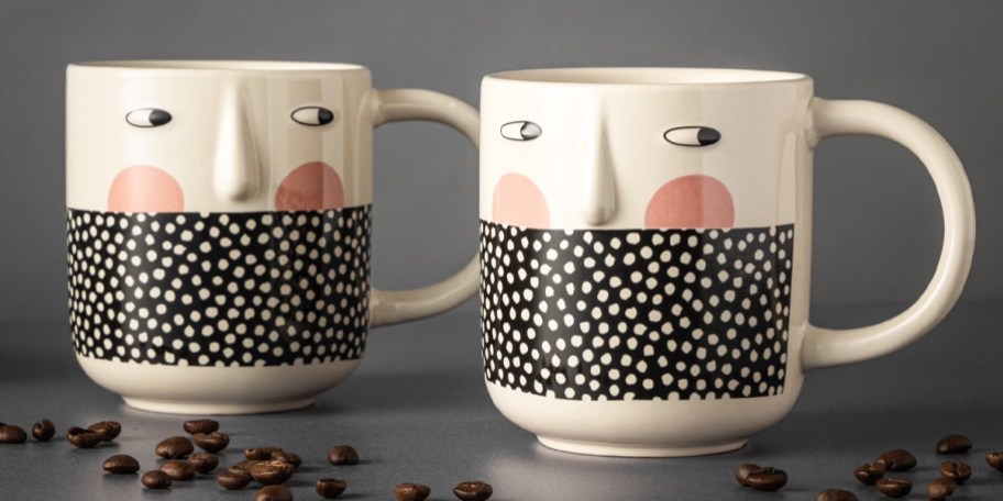 two cheeky mugs on countertop