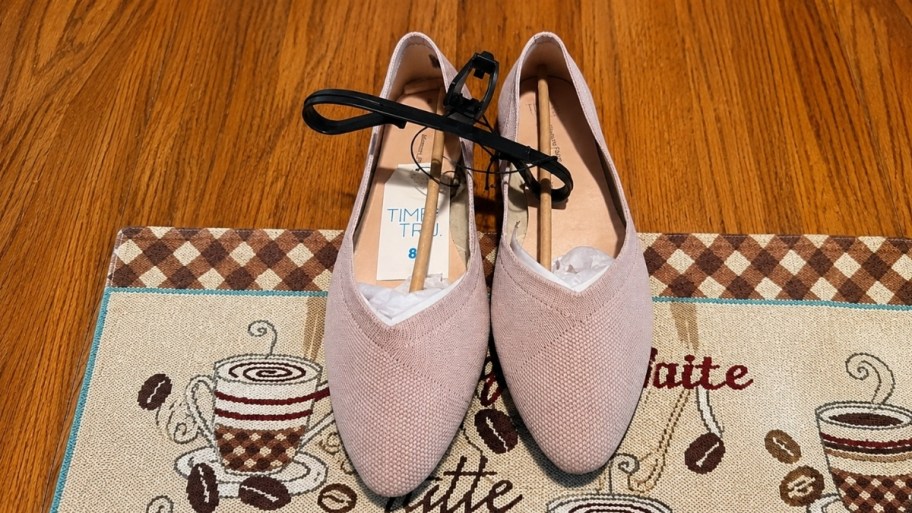 a pair of pink knit ballet flat