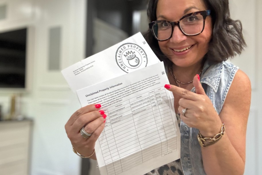 woman pointing at paper check