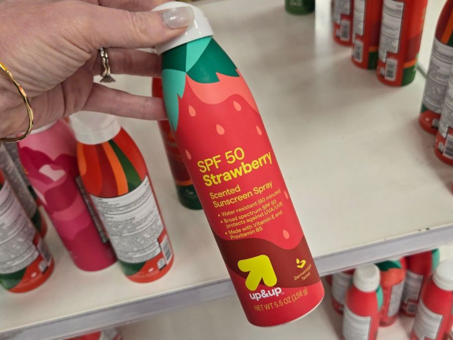 strawberry up&up SPF 50 Sunscreen Spray 5.5oz in hand in store