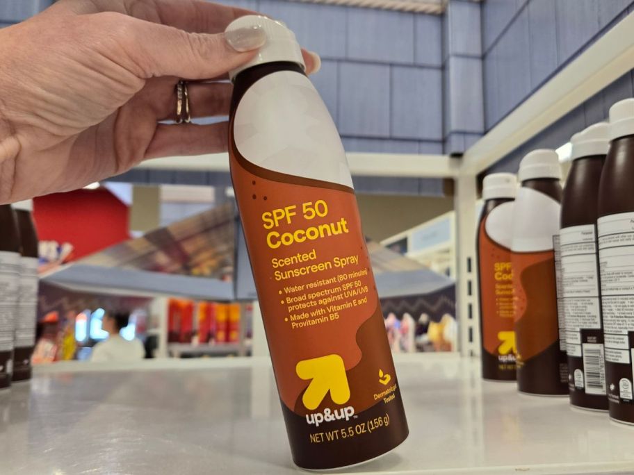 coconut up&up SPF 50 Sunscreen Spray 5.5oz in hand in store