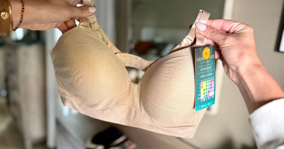 woman holding vanity fair bra