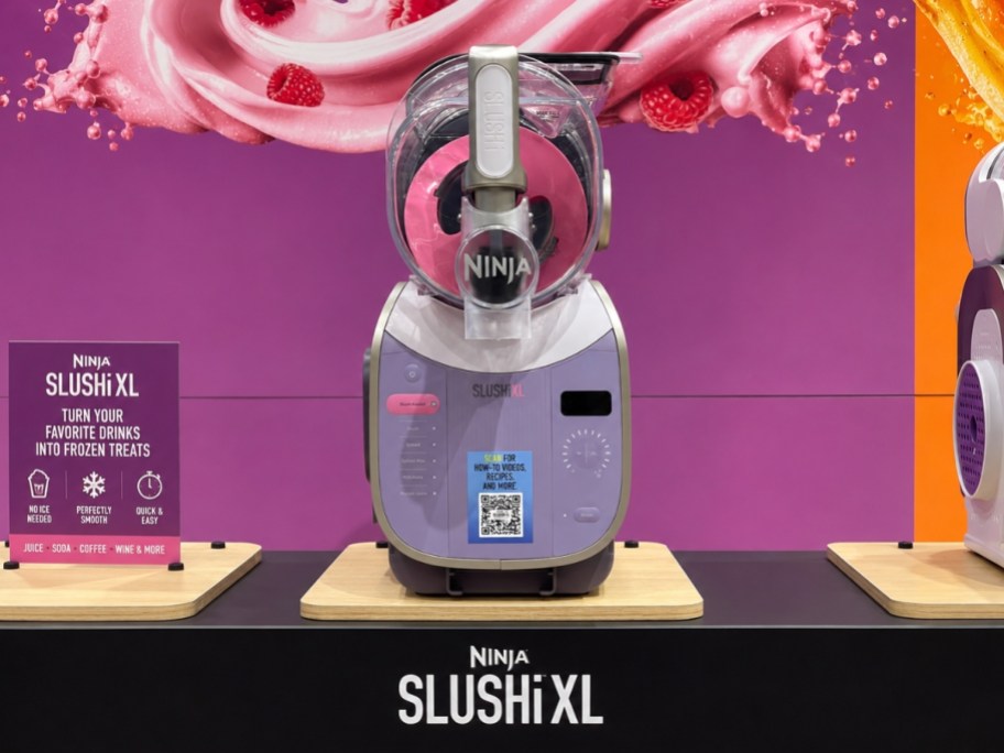 a pink and purple Ninja Slushi machine on display in a store