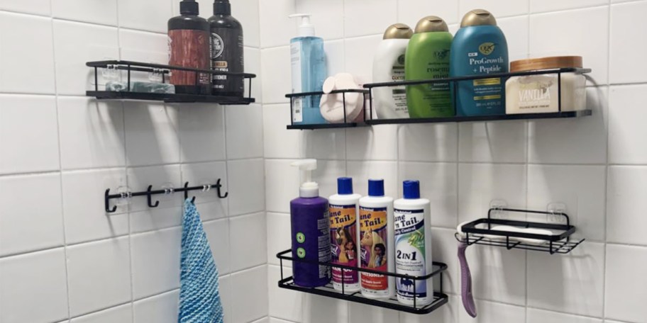 black shower caddys full of hair/body wash products