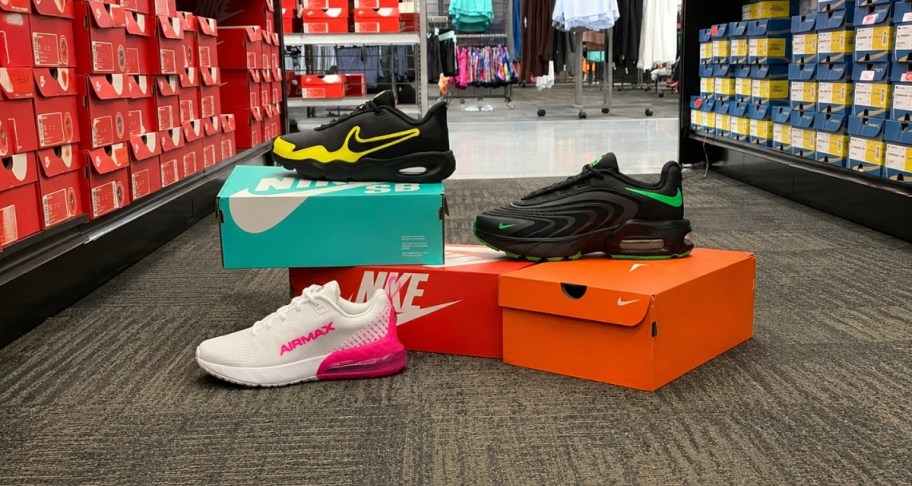 3 styles of nike air max shoes shown with shoeboxes