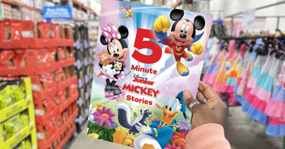 hand holding up 5-Minute Disney Junior Mickey Stories book in store