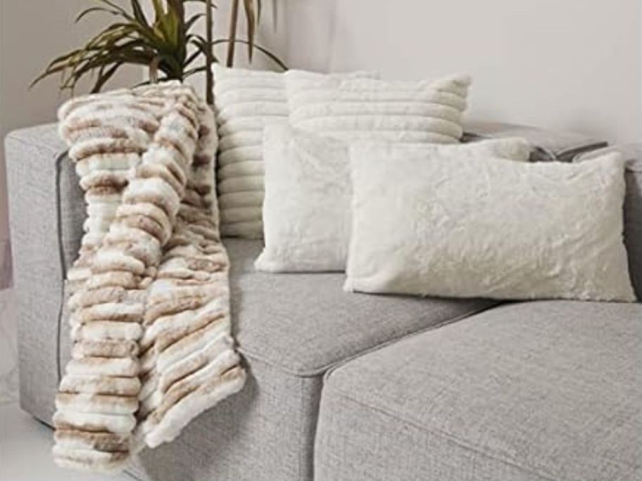 5-Piece Faux Fur Throw Blanket & Pillow Set on couch