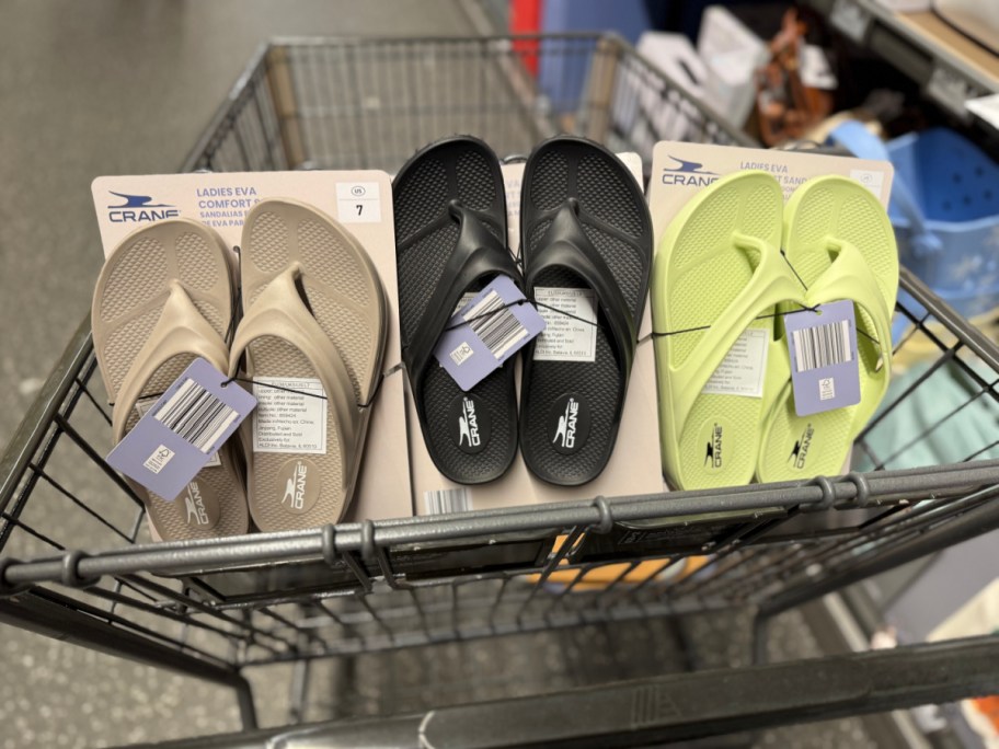 tan black and green flip flops in cart