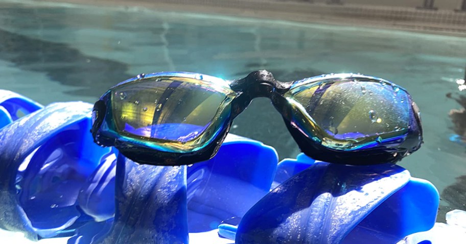 black swim goggles in a pool