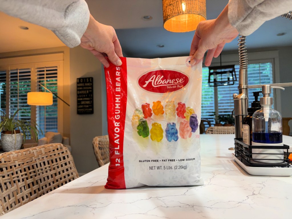 hand holding a large bag of Albanese Gummi Bears