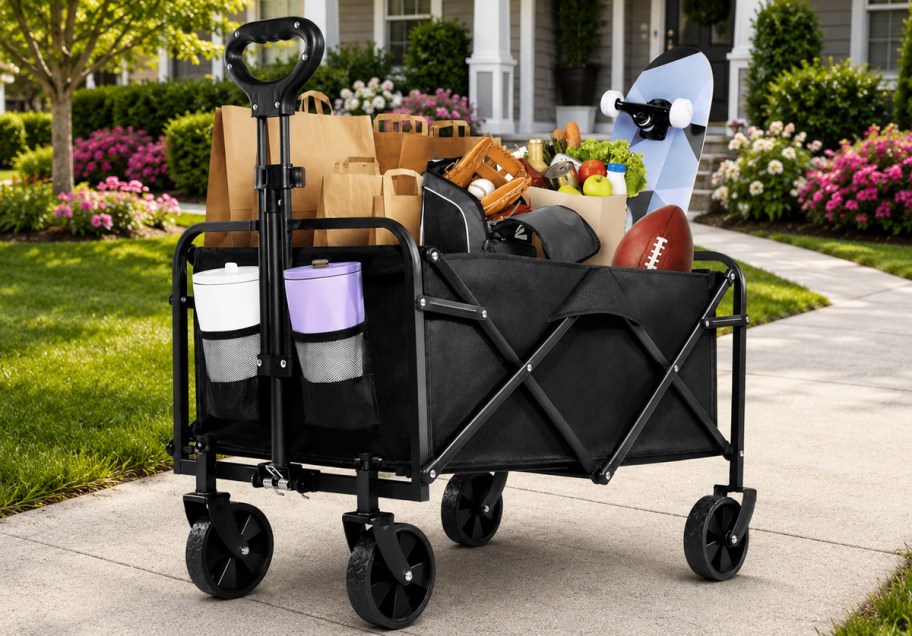 wagon filled with groceries and sports gear in front of house