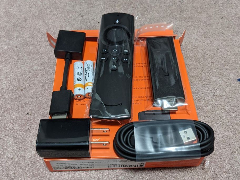 Amazon fire stick on top of its box