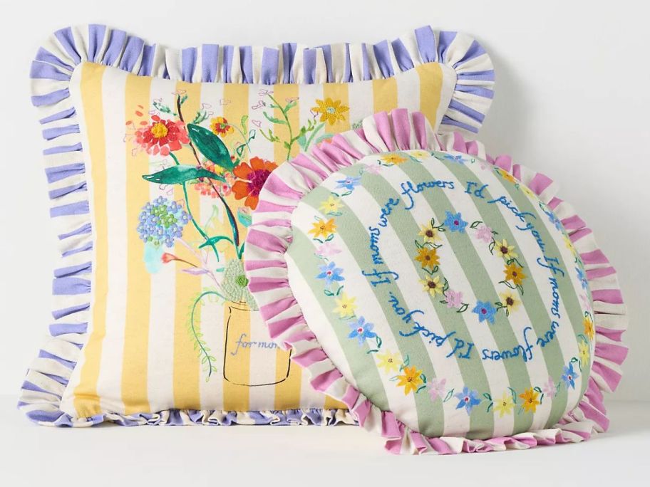 a Square and a round embroidered pillow