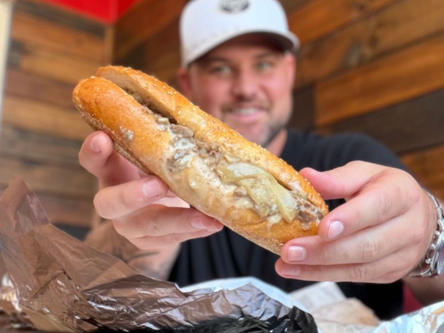 stetson holding Arby's Angus Cheesesteak