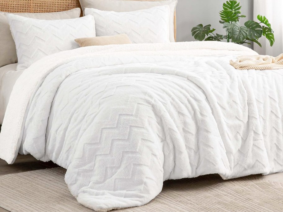 white sherpa chevron comforter set and shams on a bed