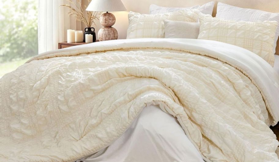 Bedlite beige color comforter set in a bedroom with white pillows