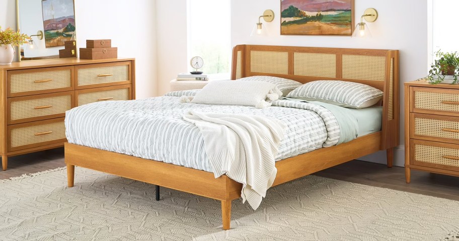 matching tan canning dresser, bed frame, and nightstand in a bedroom