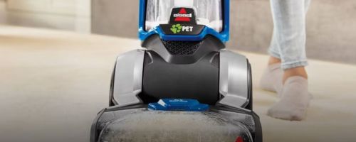 Bissell pet vacuum being used on a carpet
