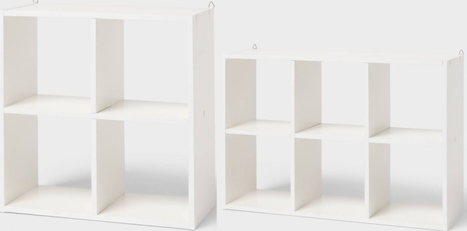 Two empty white cube organizers, one with four compartments and another with six, against a plain white background.