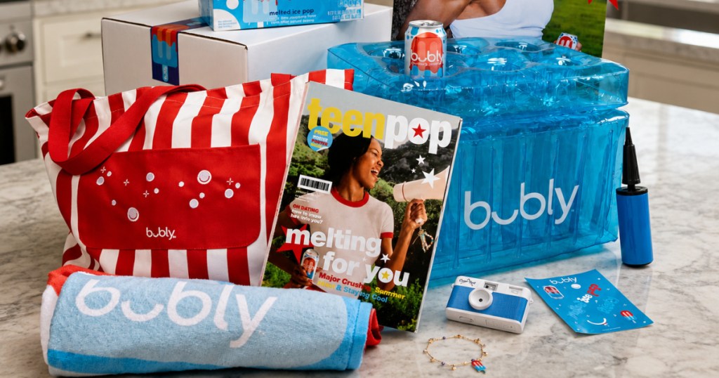 Bubly kit with towel, tote bag, camera cooler, and more on kitchen countertop