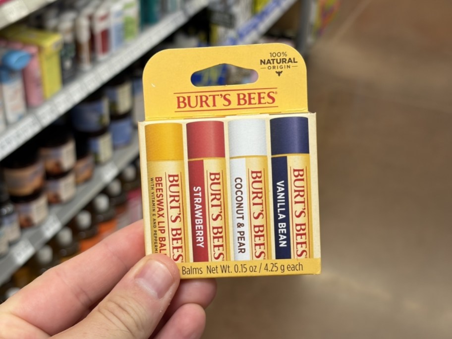 person holding pack of burt's bees lip balm in Best of Burt's Flavors in store