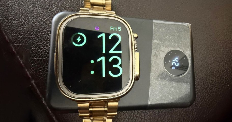 apple watch on top of a black power bank