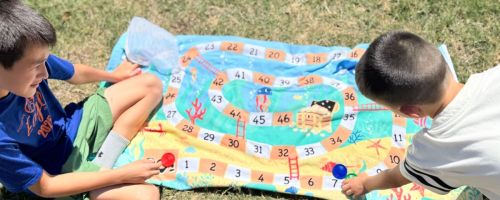 Two kids playing with CVS Towels toys
