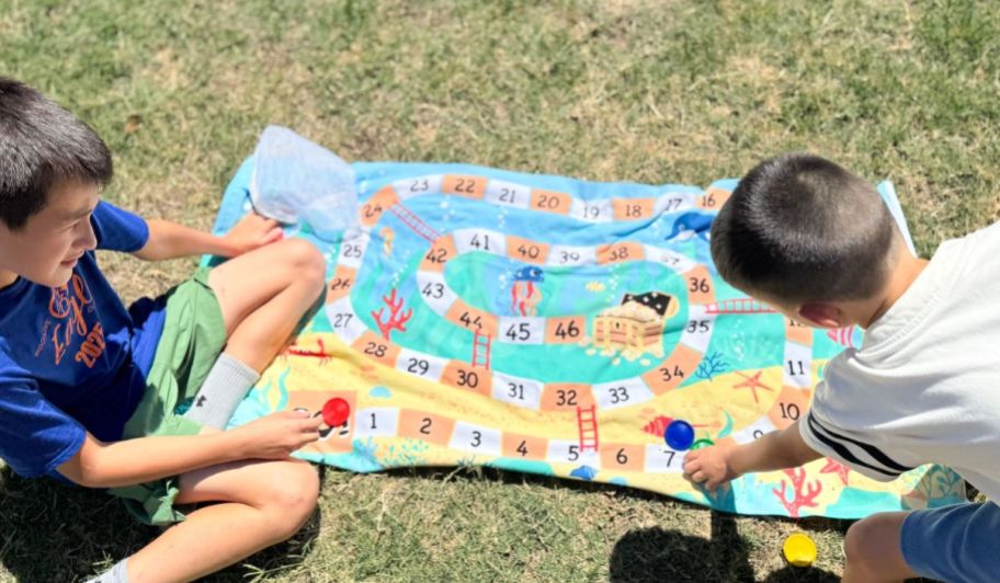 Two kids playing with CVS Towels toys