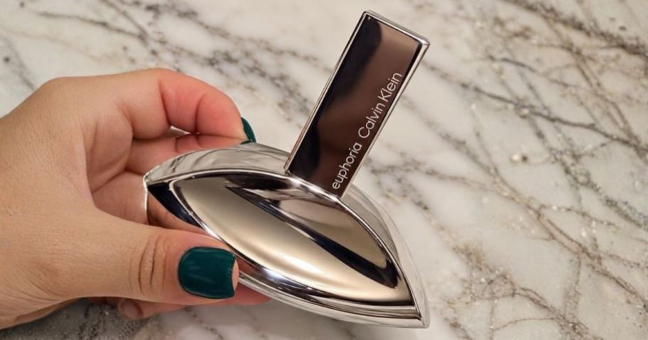 hand holding Calvin Klein Euphoria Signature Eau de Parfum Spray 3.3oz