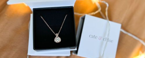 A Cate & Chloe Necklace with gift box with glwoing star shaped lights