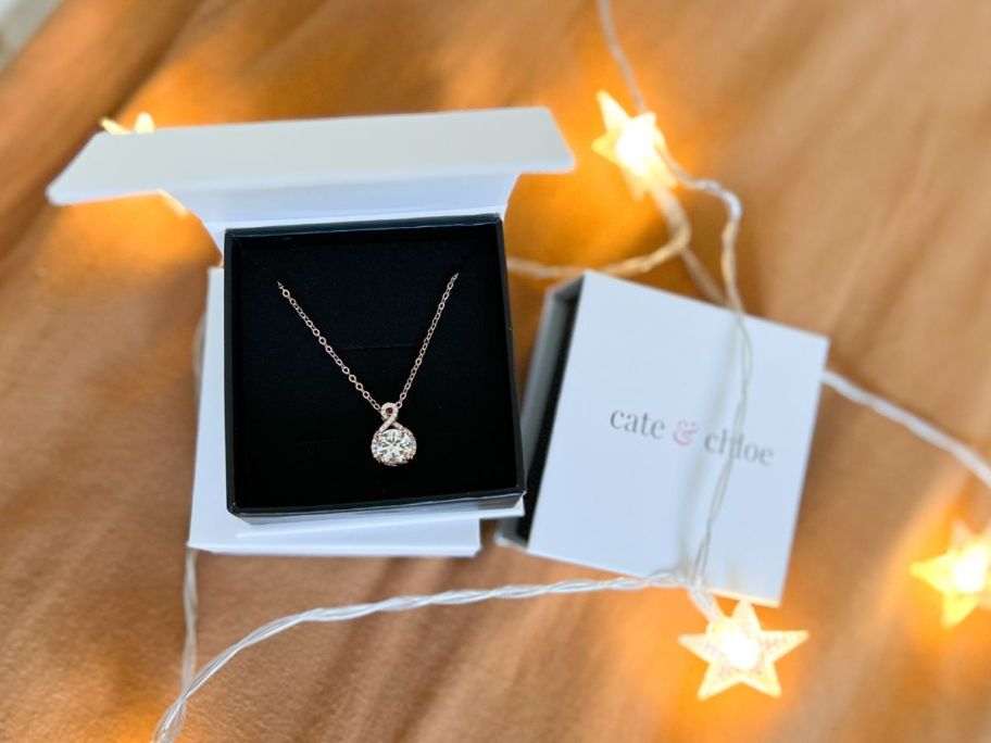 A Cate & Chloe Necklace with gift box with glwoing star shaped lights