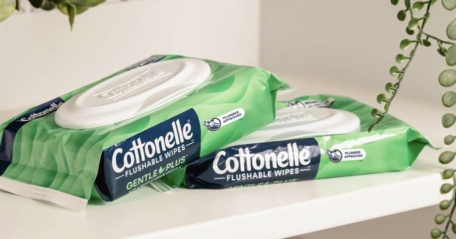 two green packs of Cottonelle GentlePlus Wet Wipes