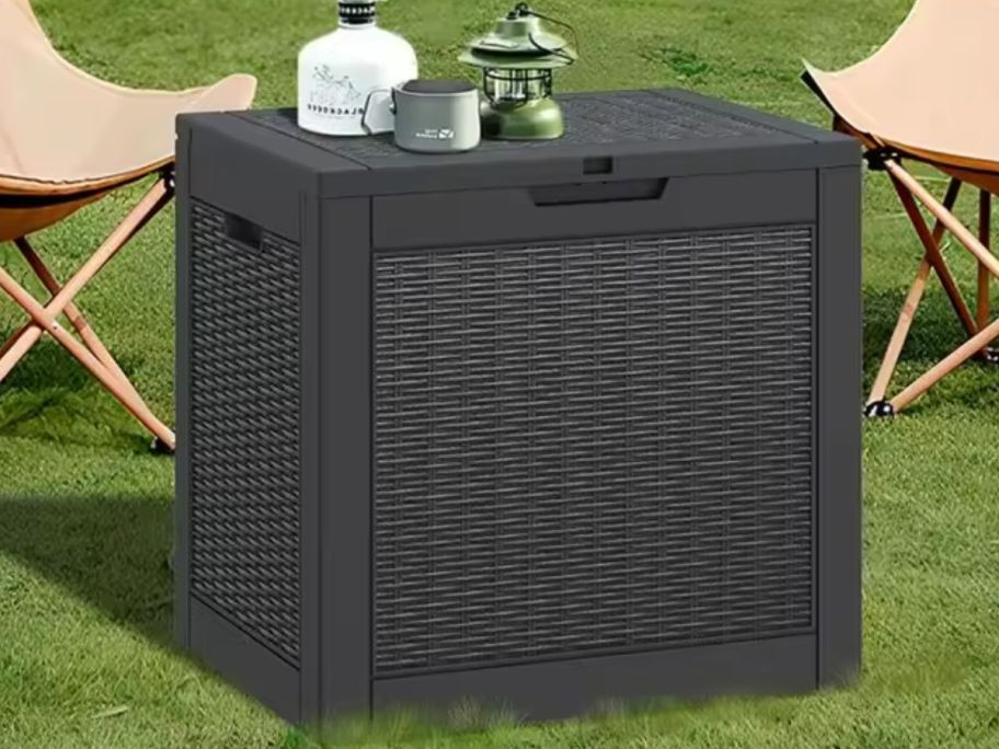 A small deck box on grass